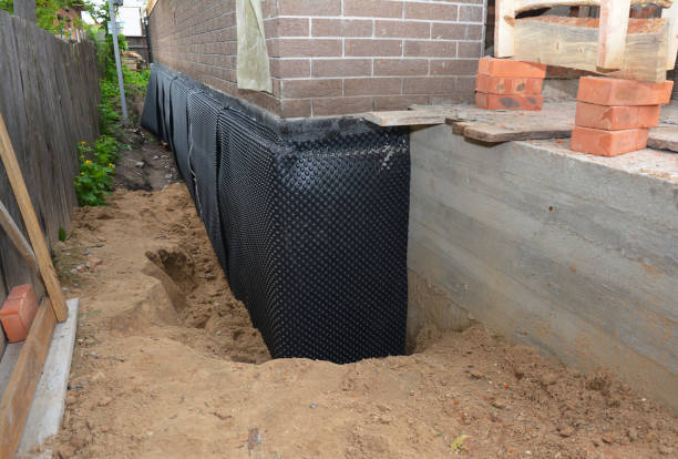 Happy homeowners after waterproofing job in Johnson Creek